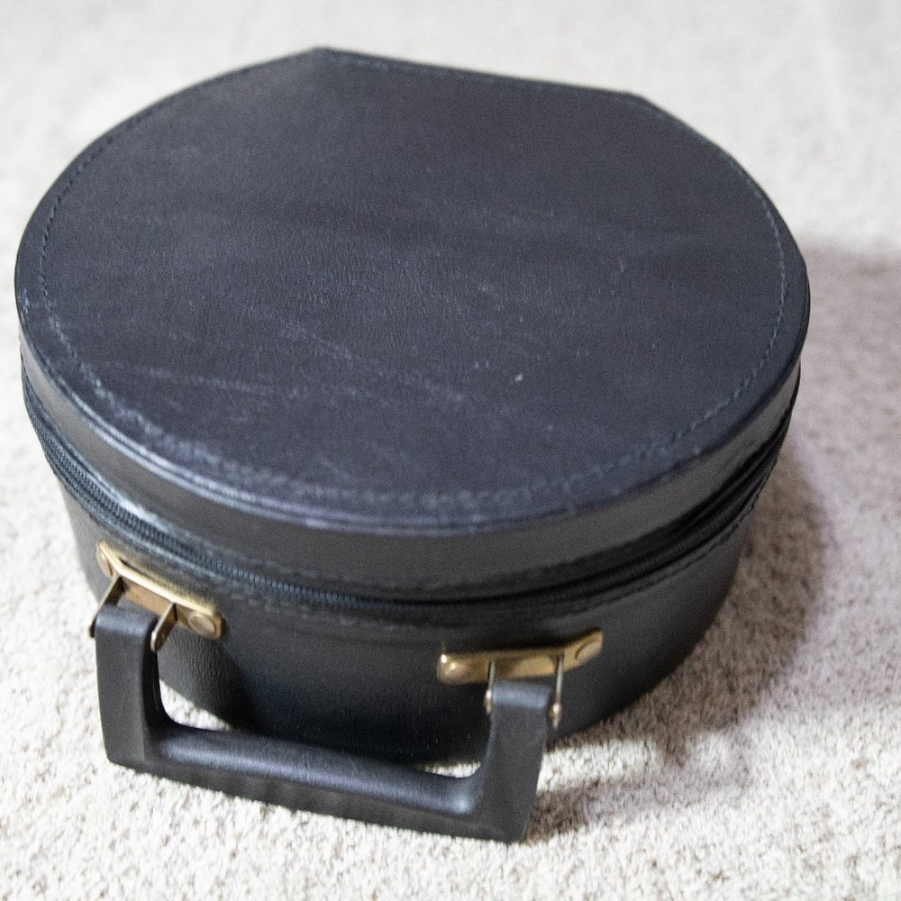 Sturdy Black Round Purse with Red Interior